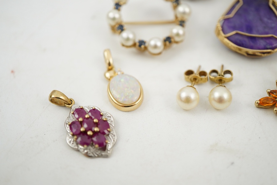 A collection of jewels, comprising: two amethyst and diamond rings; a cultured pearl and circular-cut sapphire wreath brooch; a fire opal pendant, one stone deficient; and a pair of cultured pearl earrings, all mounted i